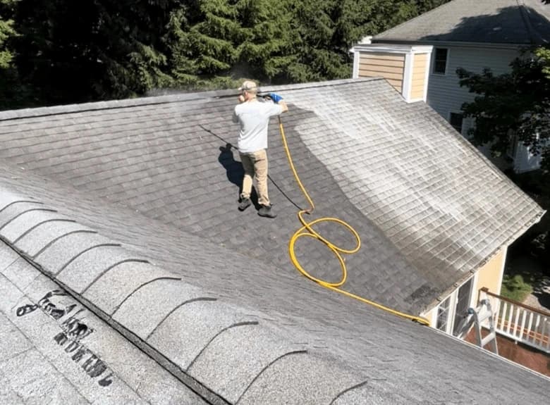 South Euclid Power Washing professional cleaning and inspecting gutters on South Euclid home